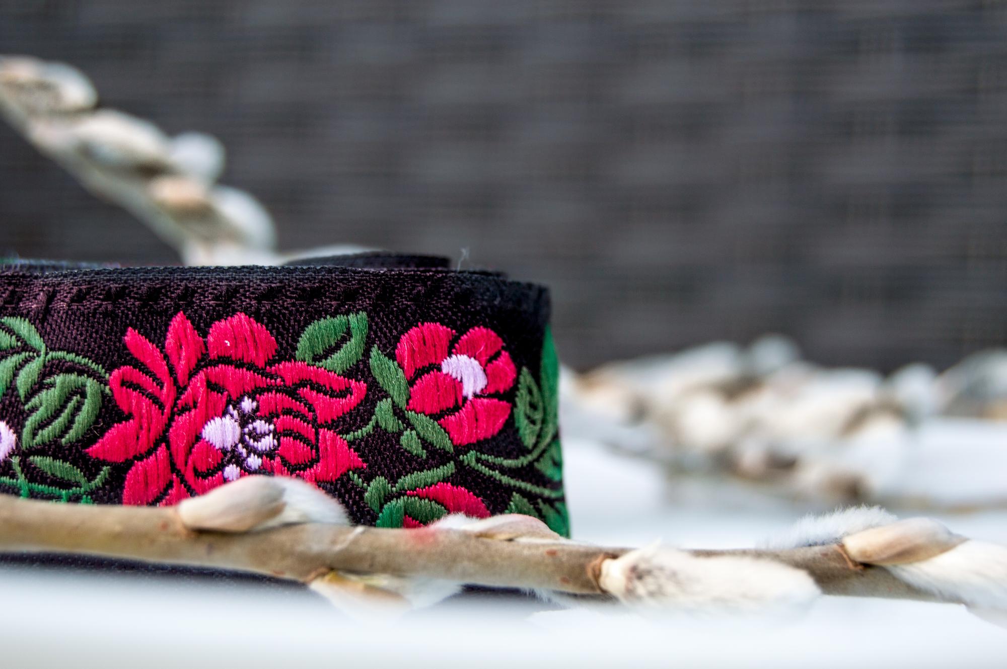 large editorial embroidered textile on table